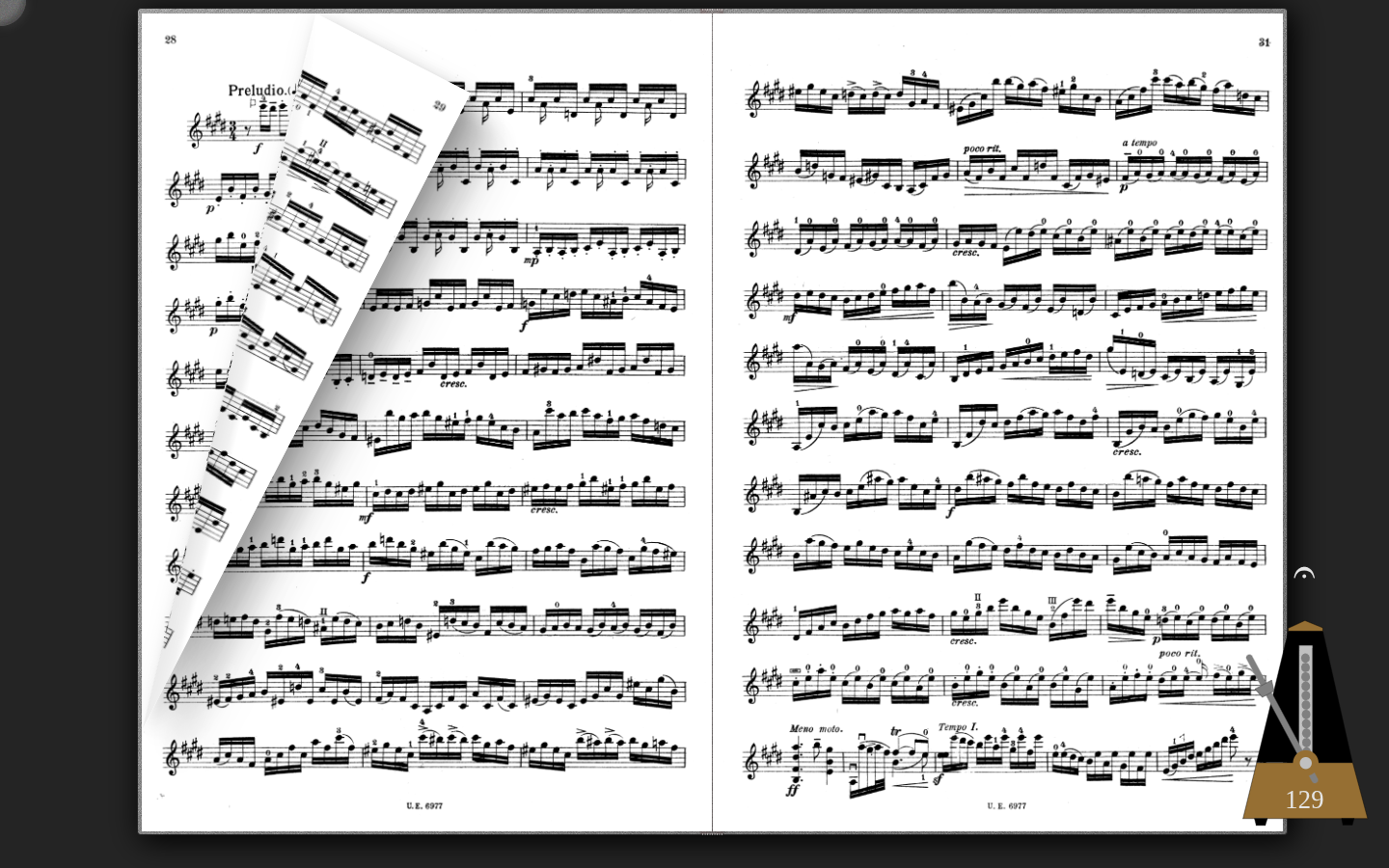 Podium open on a laptop screen showing two facing pages of sheet music side-by-side in book layout